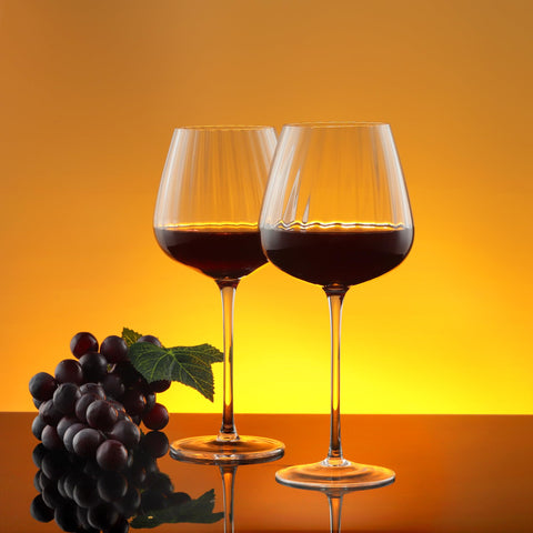 Joeyan clear ribbed stem glass detail enhances light and sparkle on white table settings.