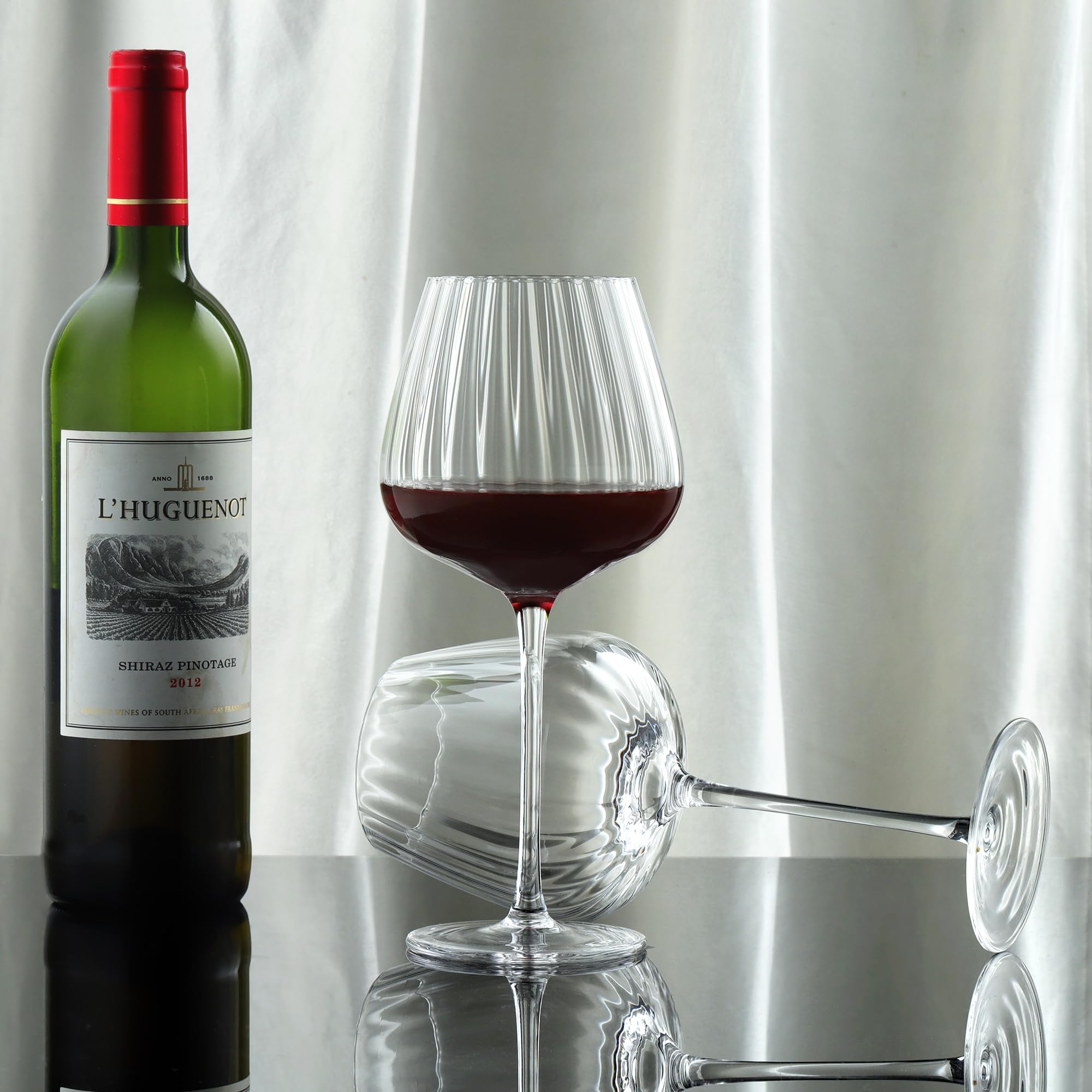 Joeyan ribbed glass texture refracts light for a multi-faceted glow.
