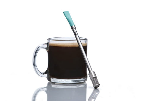JoGo portable coffee straw in hand, showcasing compact travel-ready design.