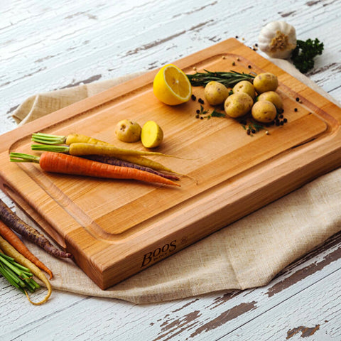 Kitchen prep area featuring John Boos BBQ Series cutting board