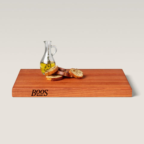 Charcuterie-ready wooden board for serving meats and cheeses.