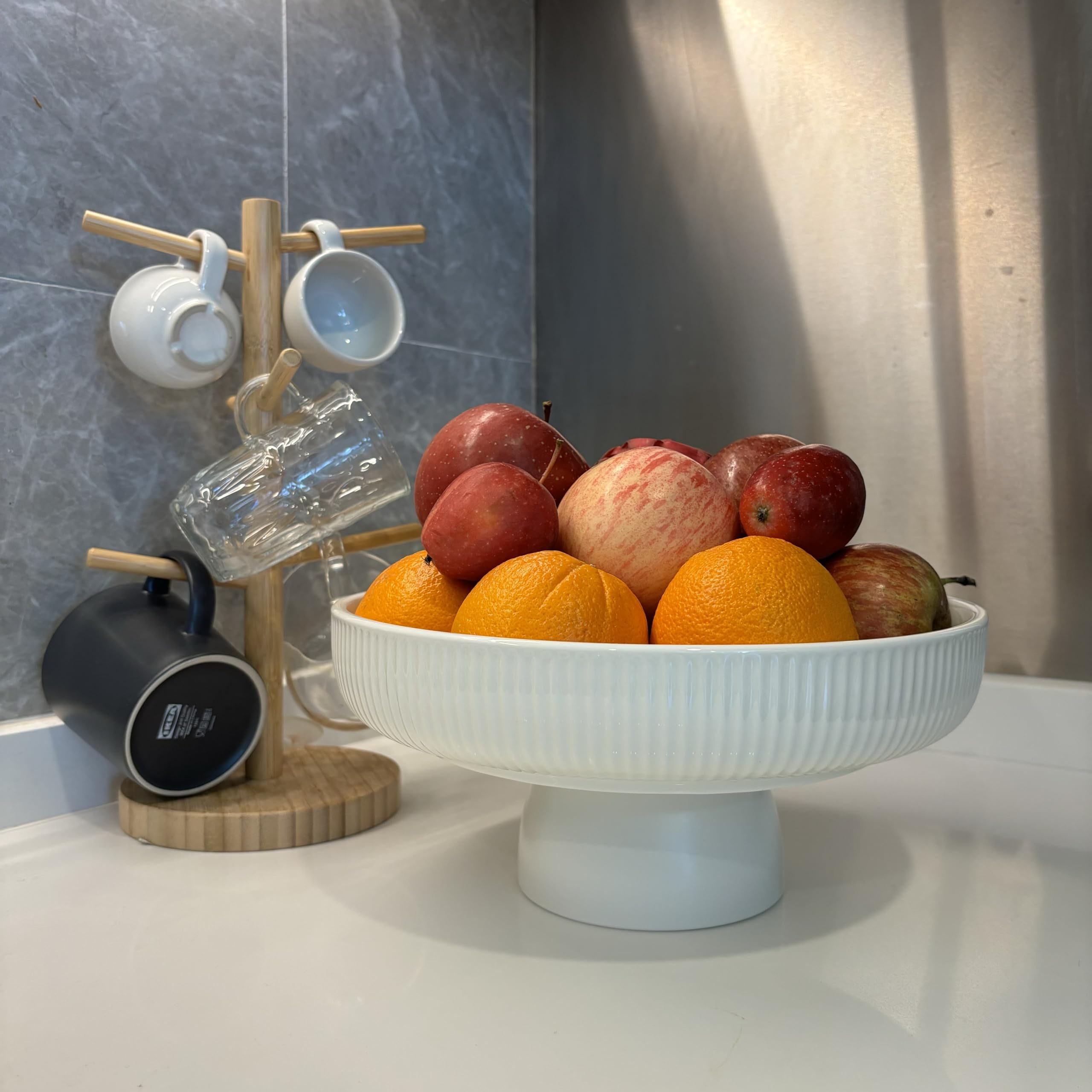 JolieJulie bowl for snacks and small decor items with white glaze and black base.