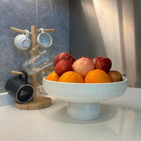 JolieJulie bowl for snacks and small decor items with white glaze and black base.