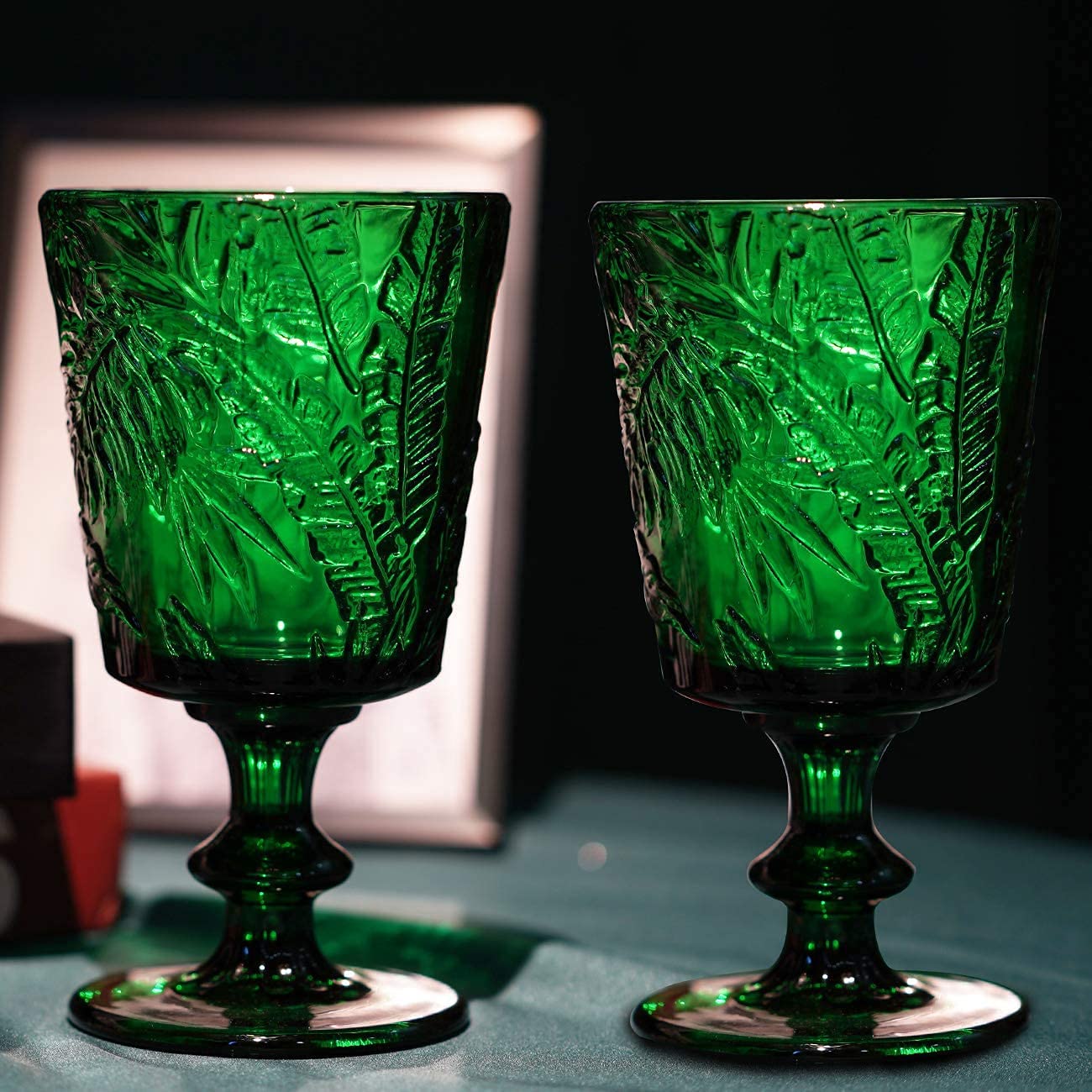 Jomop ten-ounce green wine glass offers versatile capacity for beverages and iced tea.