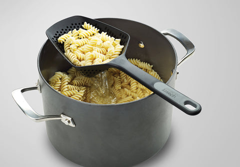 Close-up of heat-resistant silicone handle and durable head for high-temp cooking.
