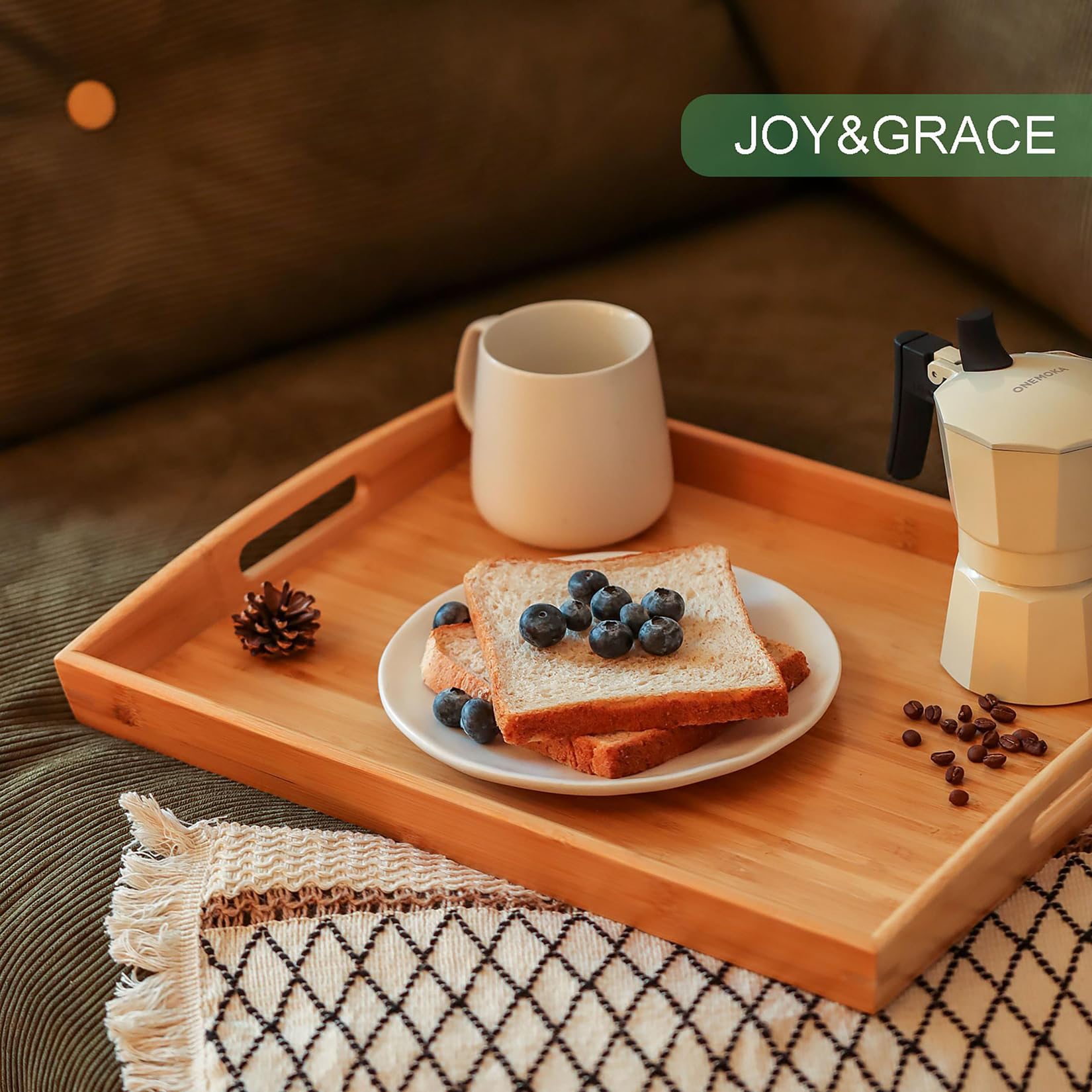 Joy&Grace ottoman decorative tray enhances living room ambiance.