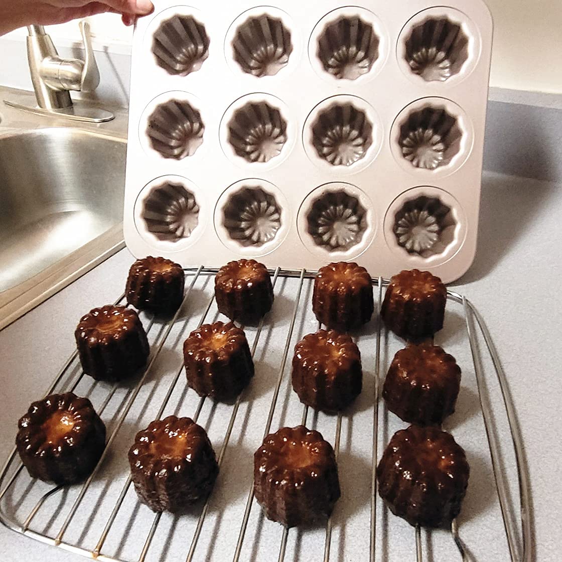 JRVT Love 12-cavity canele pan during baking action shows even heat distribution.