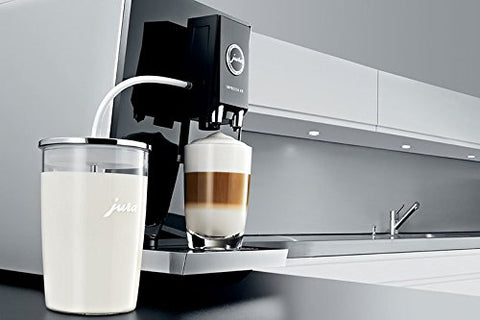 Jura glass milk container connects to machine for effortless milk prep