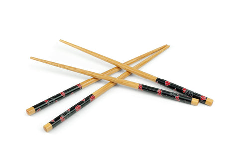Close-up of Just Funky Naruto Akatsuki pattern on wooden chopsticks.