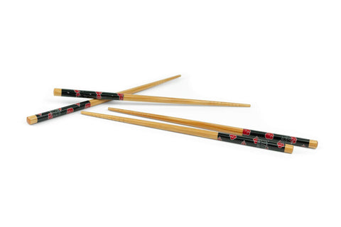 Just Funky chopsticks in use with a ramen bowl, stylish dining.