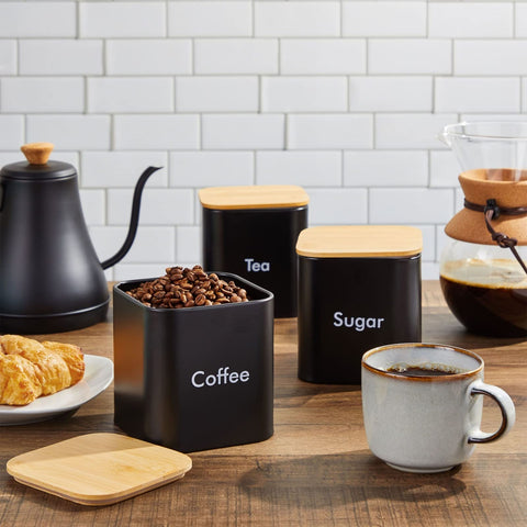 Juvale black iron tea canister keeps tea leaves fresh with airtight lid.