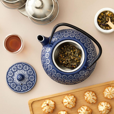 Juvale Japanese Cast Iron Teapot blue glaze on stove highlights heat retention.