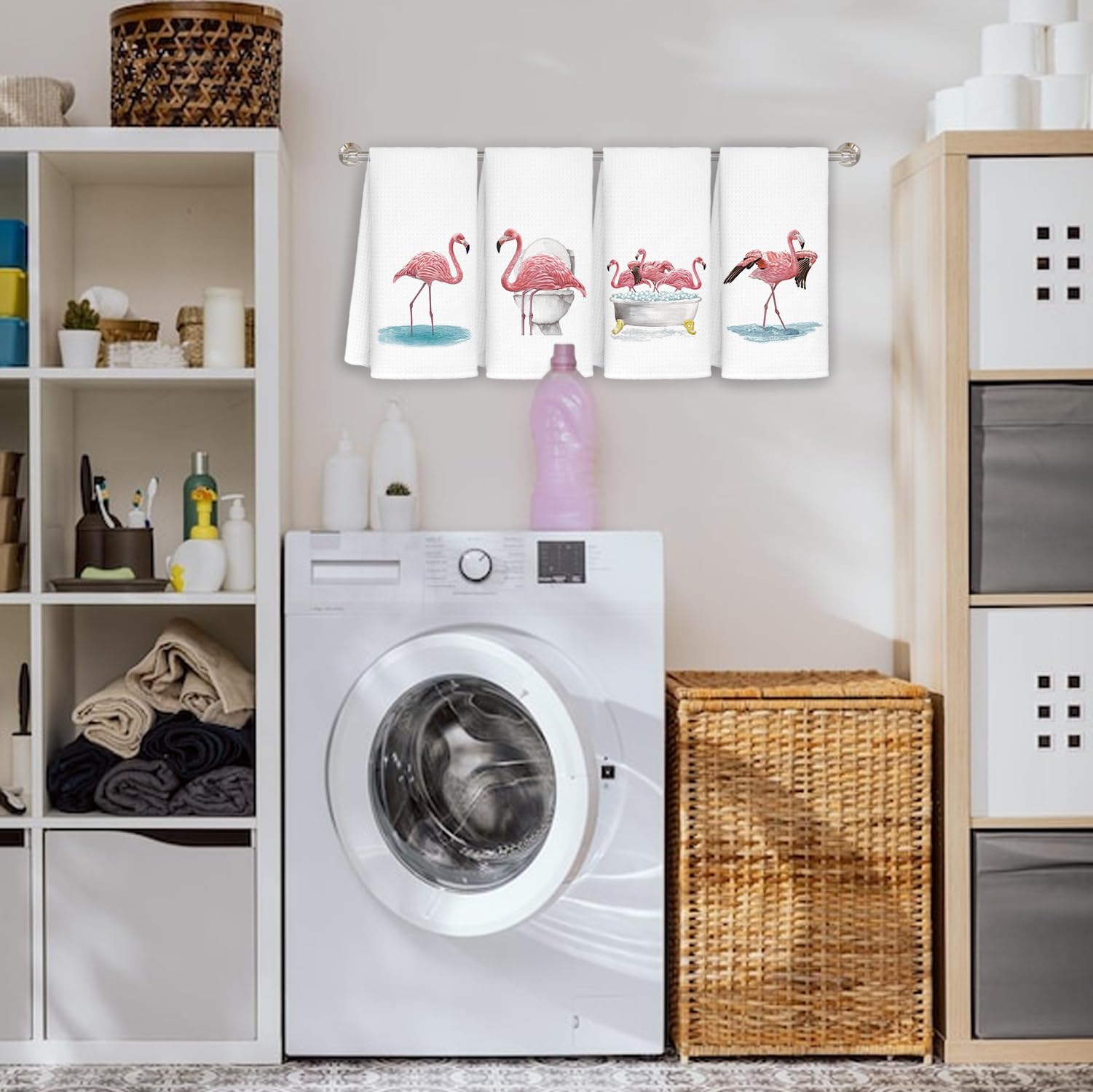 Pink flamingo towel by Jvpke displayed beside a sink as a decorative yet functional piece