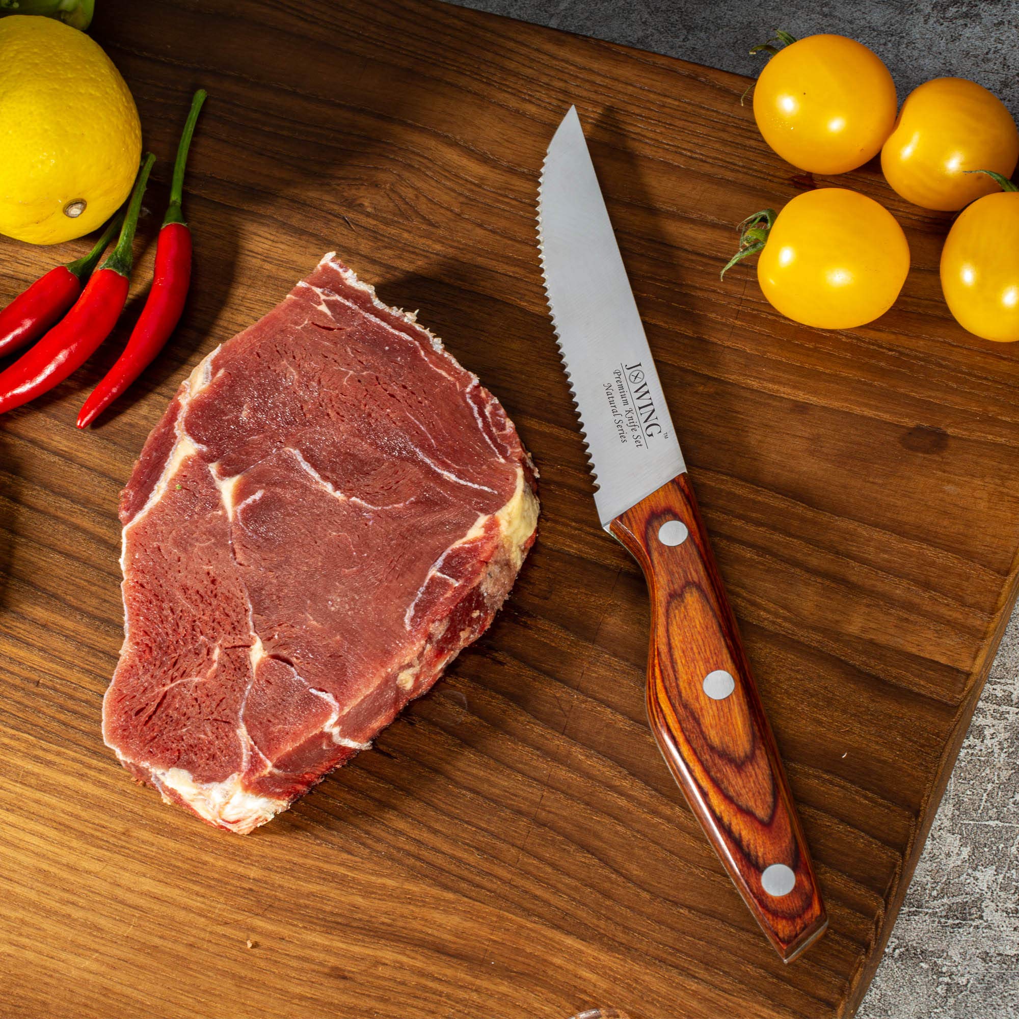 JXWING knife set in kitchen demonstrates time-saving serrated cutting.