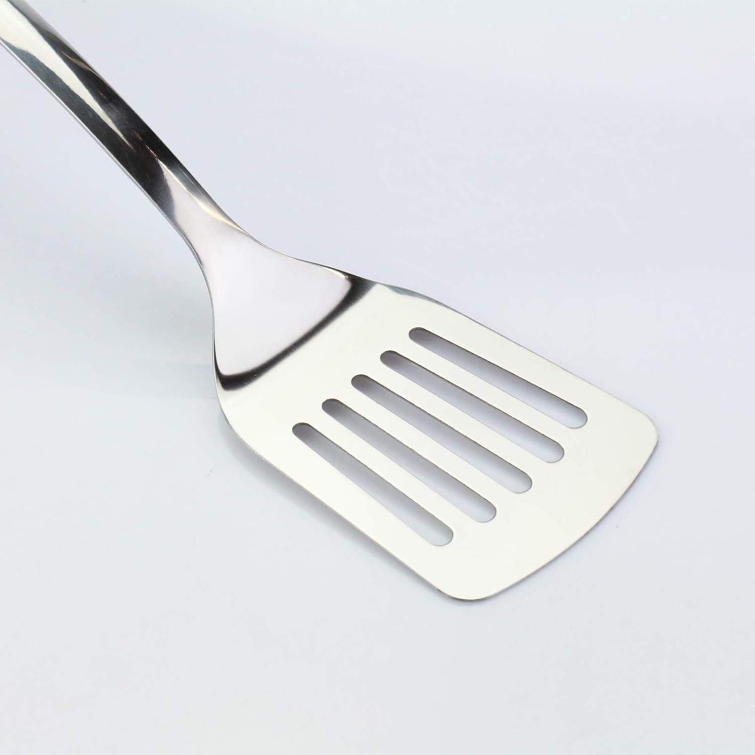 JXWING versatile spatula for fish, steak, eggs, and pancakes in any kitchen.