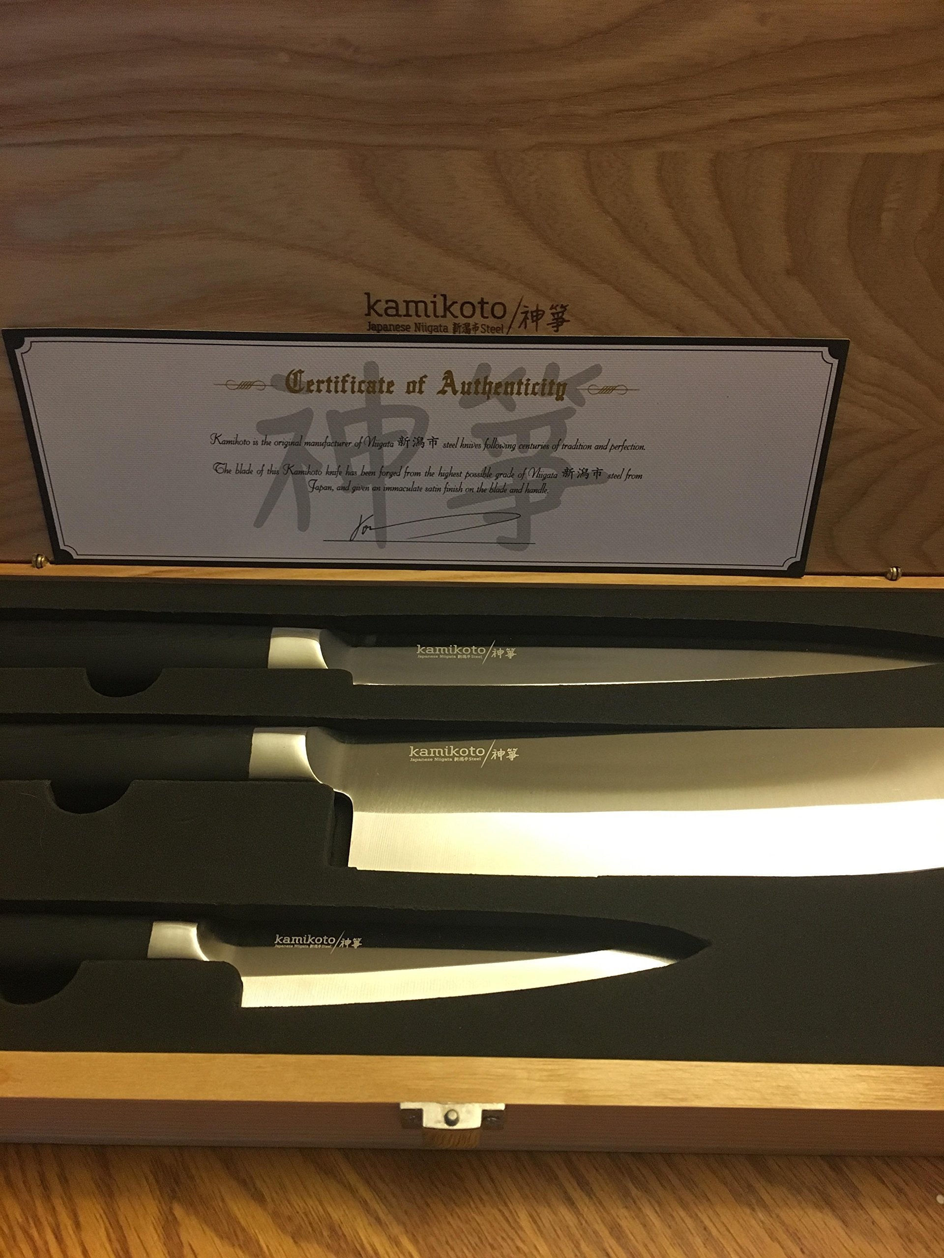 Close-up of a Kamikoto Kanpeki blade showing sharp edge and mirror finish