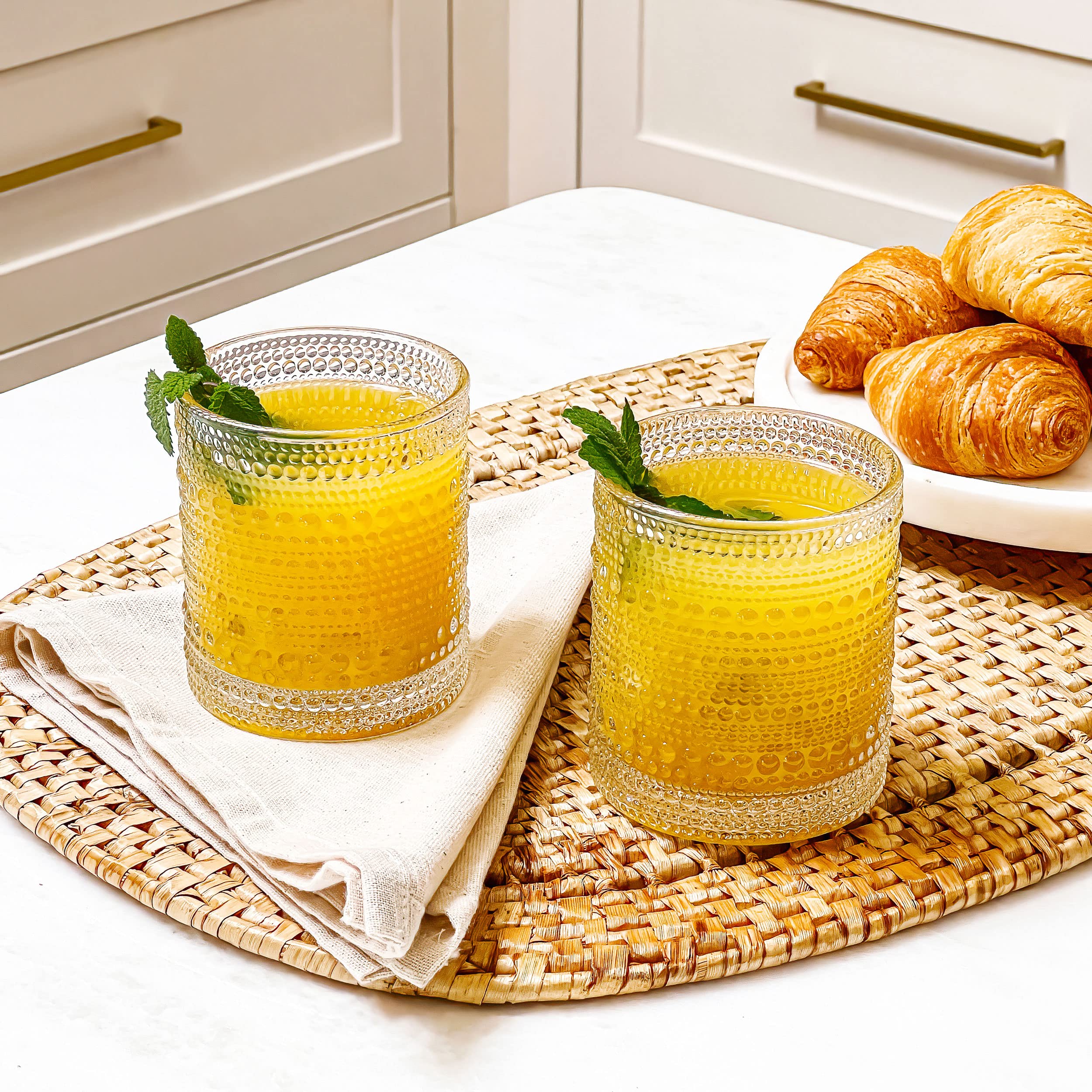 Kate Aspen bar cart display glasses enhance entertaining with timeless elegance.