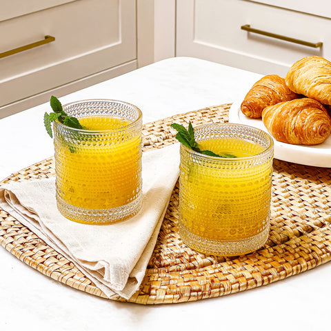 Kate Aspen bar cart display glasses enhance entertaining with timeless elegance.