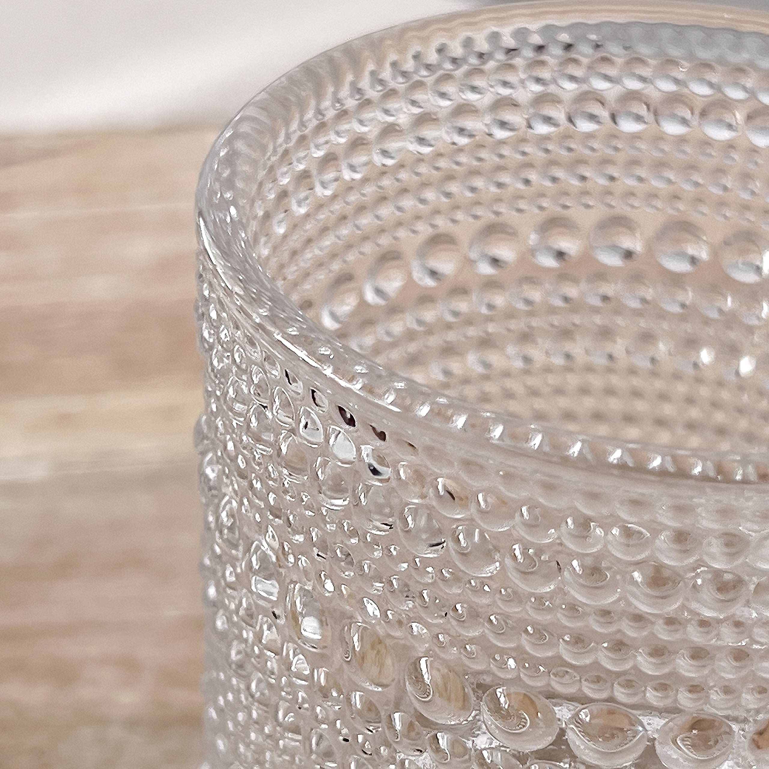 Kate Aspen decorative glassware doubles as flower holders and small desk accents.