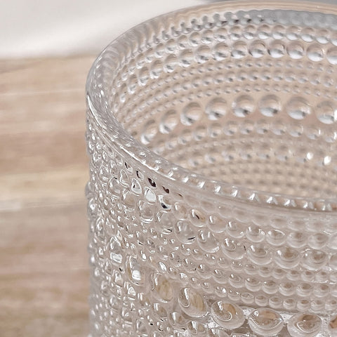 Kate Aspen decorative glassware doubles as flower holders and small desk accents.