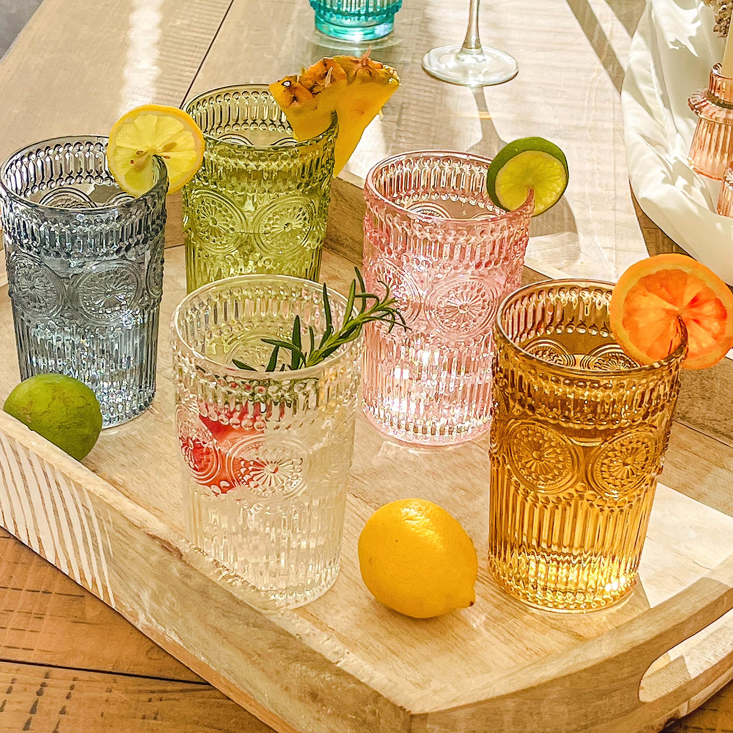 Kate Aspen green glassware displayed on a stylish bar cart.