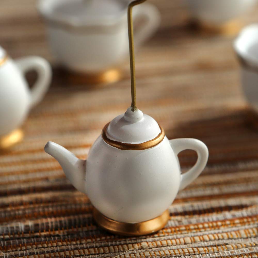 Tea Time Whimsy table setup featuring teapot and teacup holders