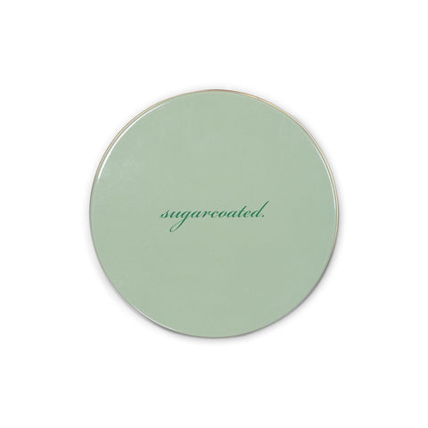 kate spade new york tin lid close-up shows glossy finish and secure seal.