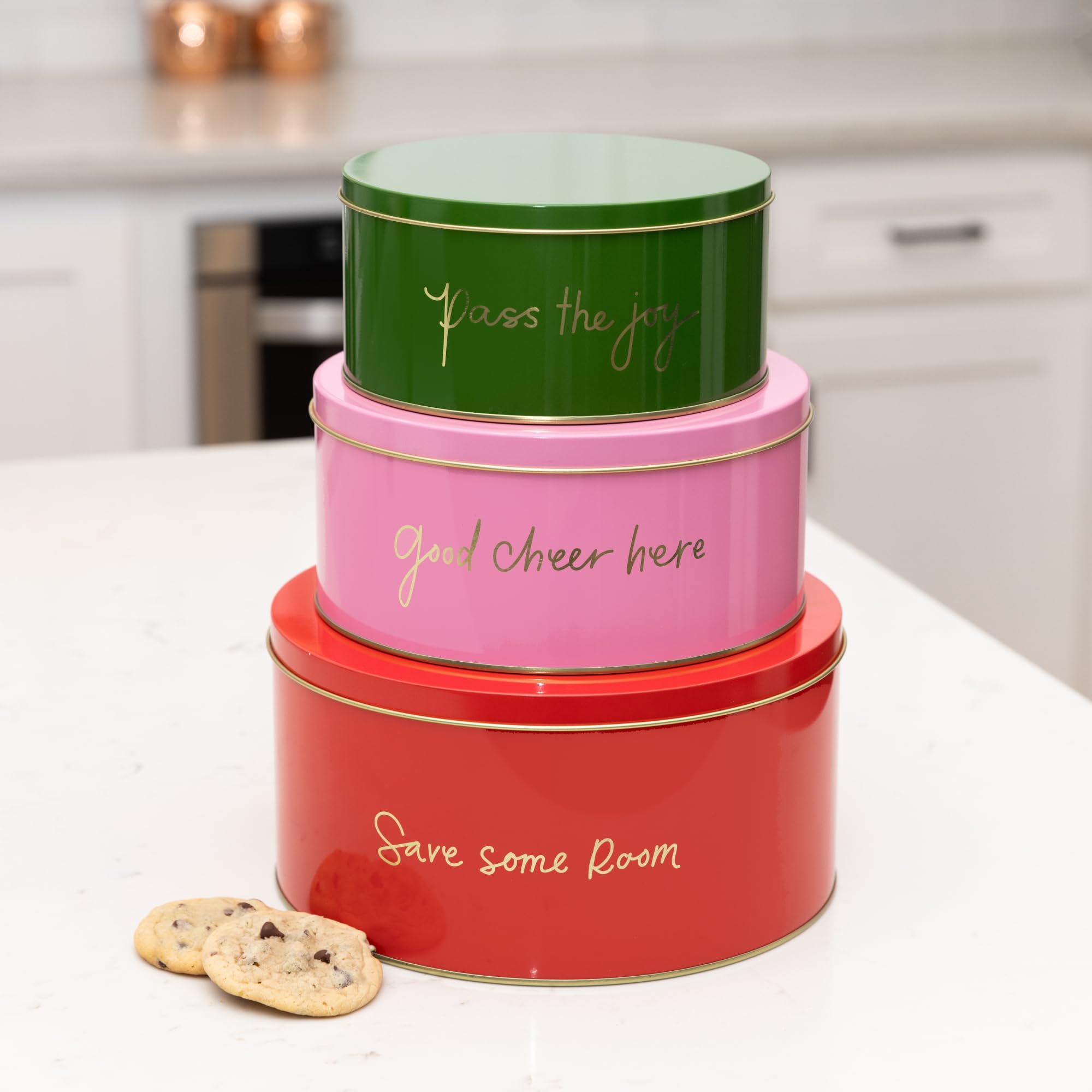 Kate Spade New York decorative tins set on shelf, stylish storage for gifts and seasonal treats.