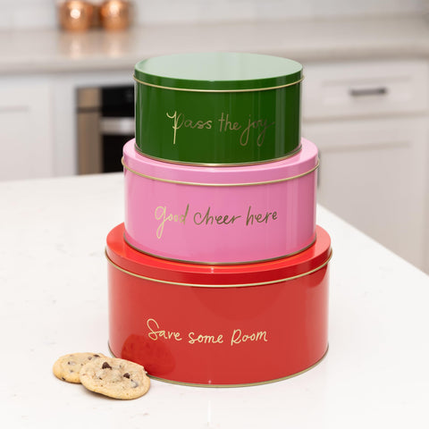 Kate Spade New York decorative tins set on shelf, stylish storage for gifts and seasonal treats.