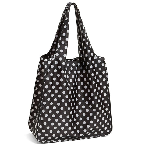 Kate Spade New York reusable tote in black dots with roll-up design for easy storage.