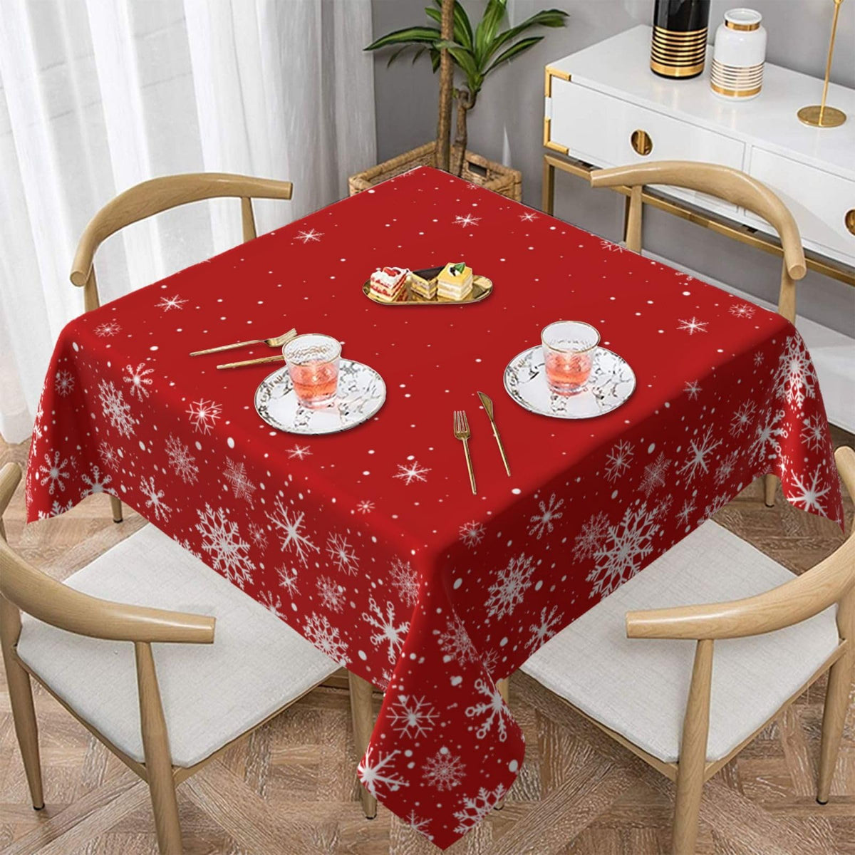 Kawani Merry Christmas tablecloth 54inch on dining table with festive red snowflakes.