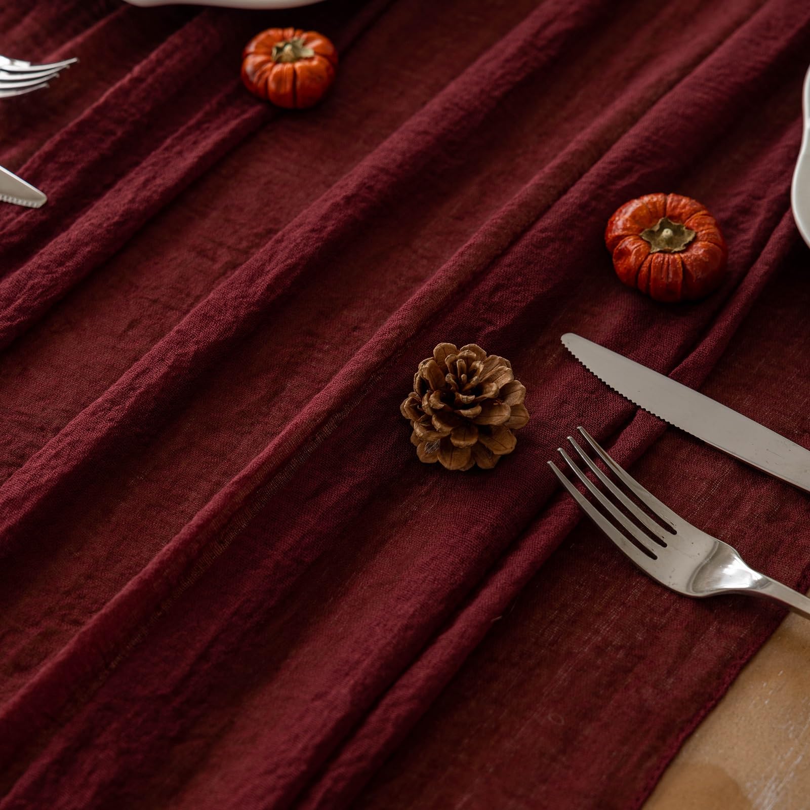 Keketoarrange wedding arches styled with burgundy table runner