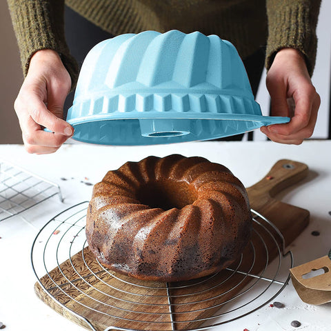 Kenond blue silicone pan in oven demonstrates bake-ready versatility.