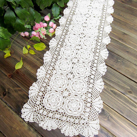 KEPSWET white crochet lace table runner highlights centerpiece with elegant handmade detail.