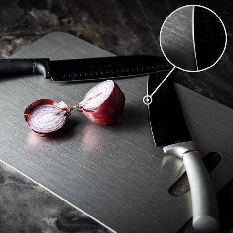 Kesefunm titanium cutting board in use for herbs and proteins