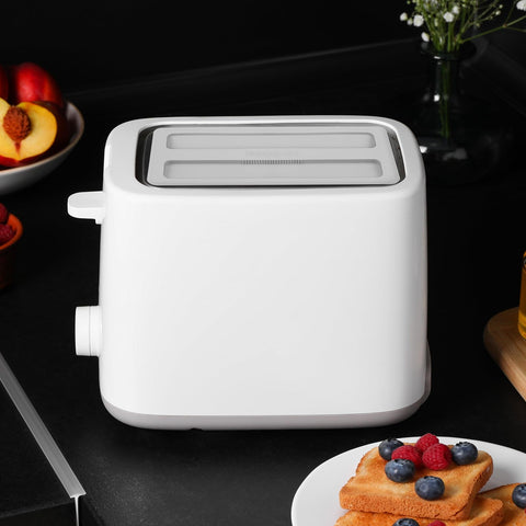 Kichvoe silicone toaster lid shields against kitchen splashes.