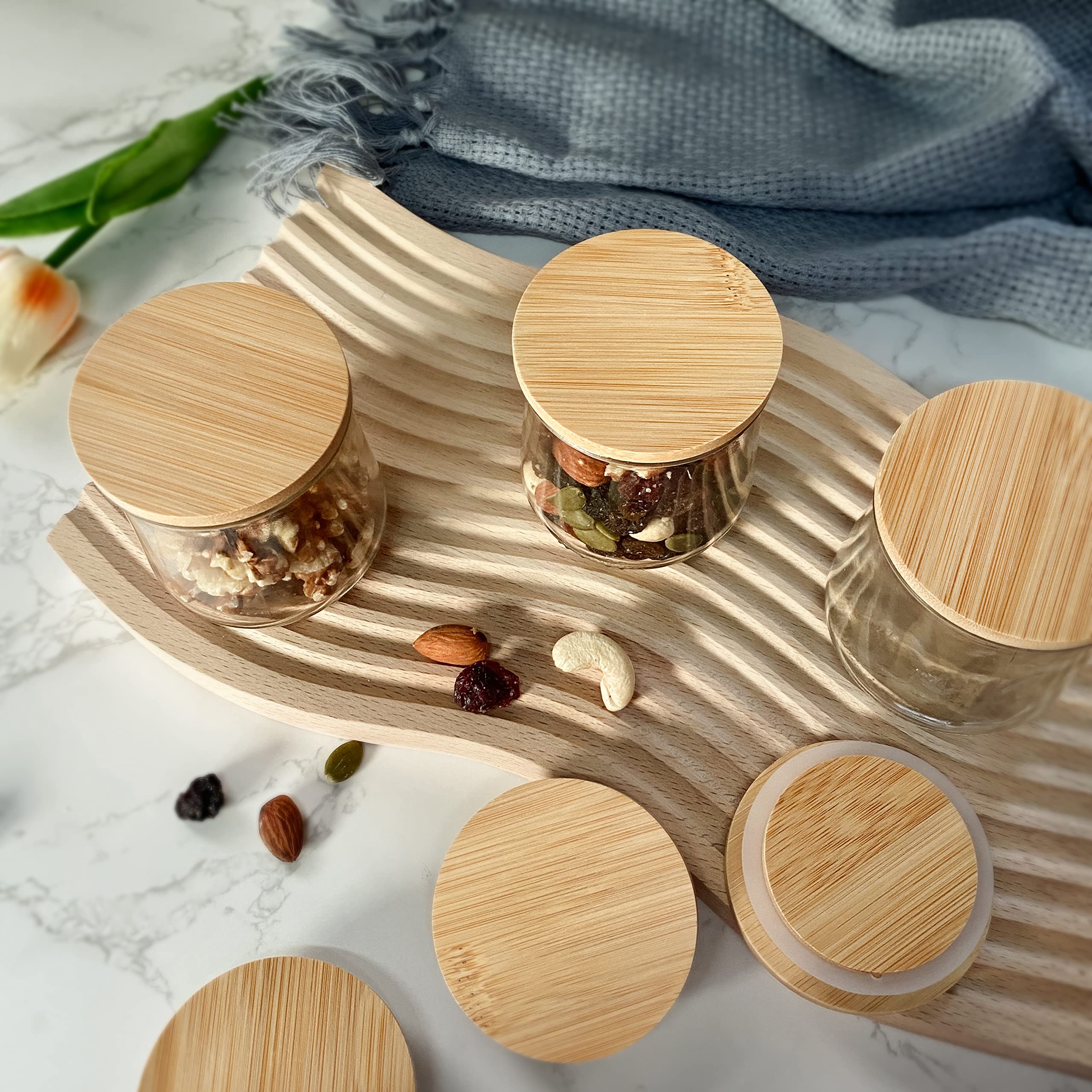 KIKINIKO Oui lids in a kitchen, compact storage solution for yogurt jars.
