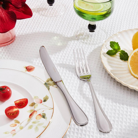 KINGSTONE dinner spoons and knives arranged for an upscale table setting