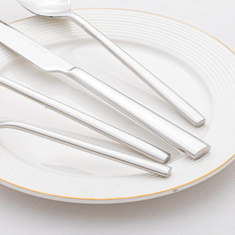 Kingstone mirror-polished finish detail showcases sleek, elegant dining ware.
