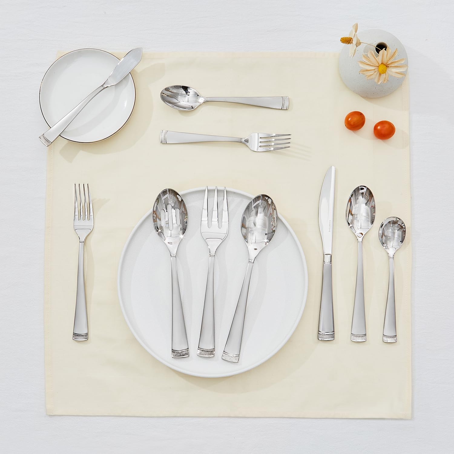 Kingstone mirror-polished finish reflecting light on tableware