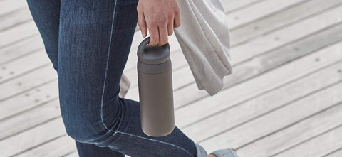 Kinto Dayoff tumbler easy-grip handle close-up for comfortable carry on walks.