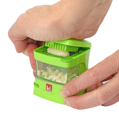 Clear container of Garlic-A-Peel ready to collect crushed garlic