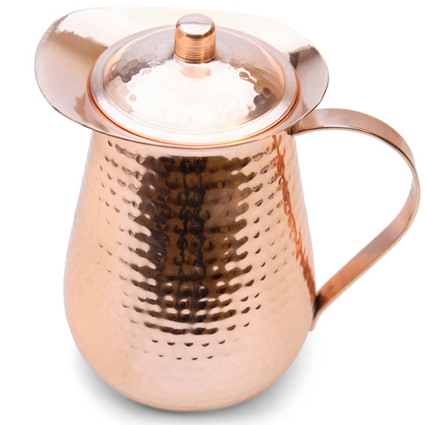 Kitchen Science copper pitcher pour view highlighting wide mouth for easy filling.
