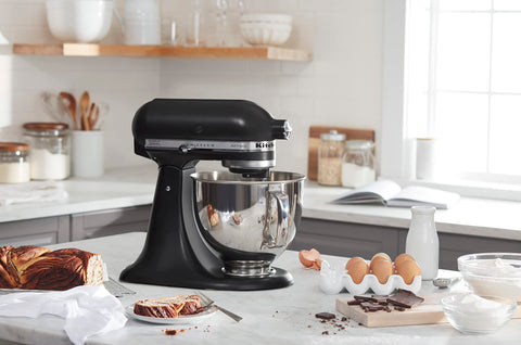 KitchenAid Artisan 5-Qt pouring shield keeps counters clean during mixing.