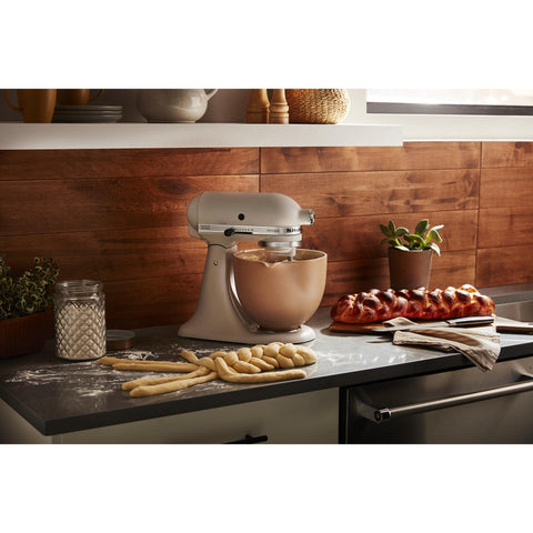 KitchenAid ceramic bowl withstands freezer, microwave, and oven use up to 475 degrees Fahrenheit.