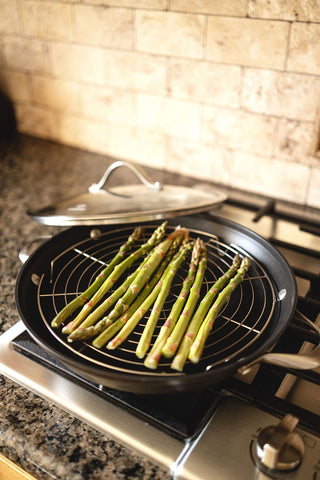 KITCHENATICS round cooling rack serves as a sturdy trivet for hot dishes