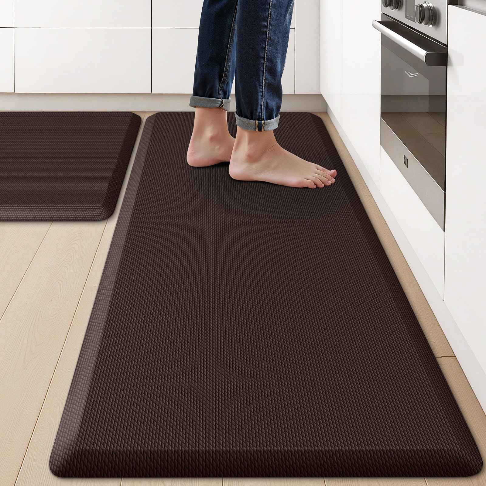 KitchenClouds two-piece kitchen mats on the floor for enhanced standing comfort.