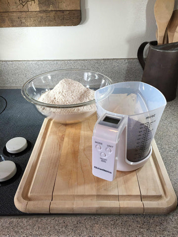 Detachable washable measuring cup for quick cleanup after cooking with KitchenMetrics