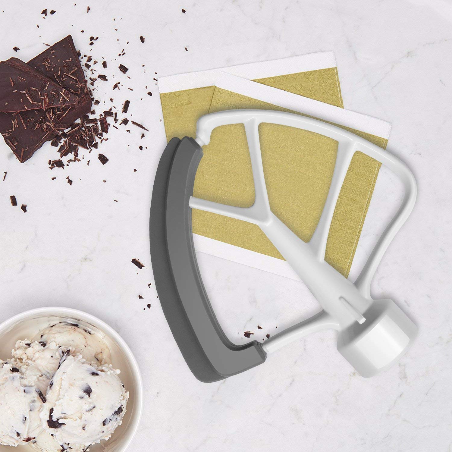 KITCHPOWER scraper-spatula edge helps wipe bowls while pouring batters.