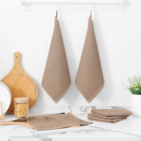 Kitinjoy tan dish cloths neatly stacked on the counter